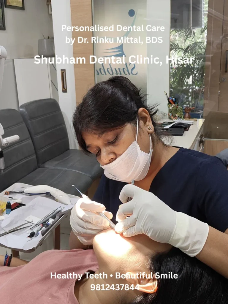 Dr. Rinku Mittal examining a patient at Shubham Dental Clinic in Hisar